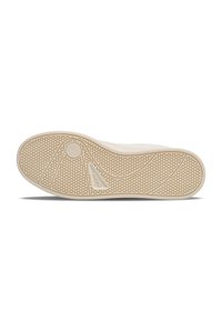 Shoe sole in light rubber with a textured honeycomb pattern. Features curved lines and a circular accent near the heel for traction.