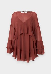 Blouse transparente couleur rouille avec manches longues évasées à volants, ourlet froncé et fermeture par un lien au niveau de l'encolure dos.