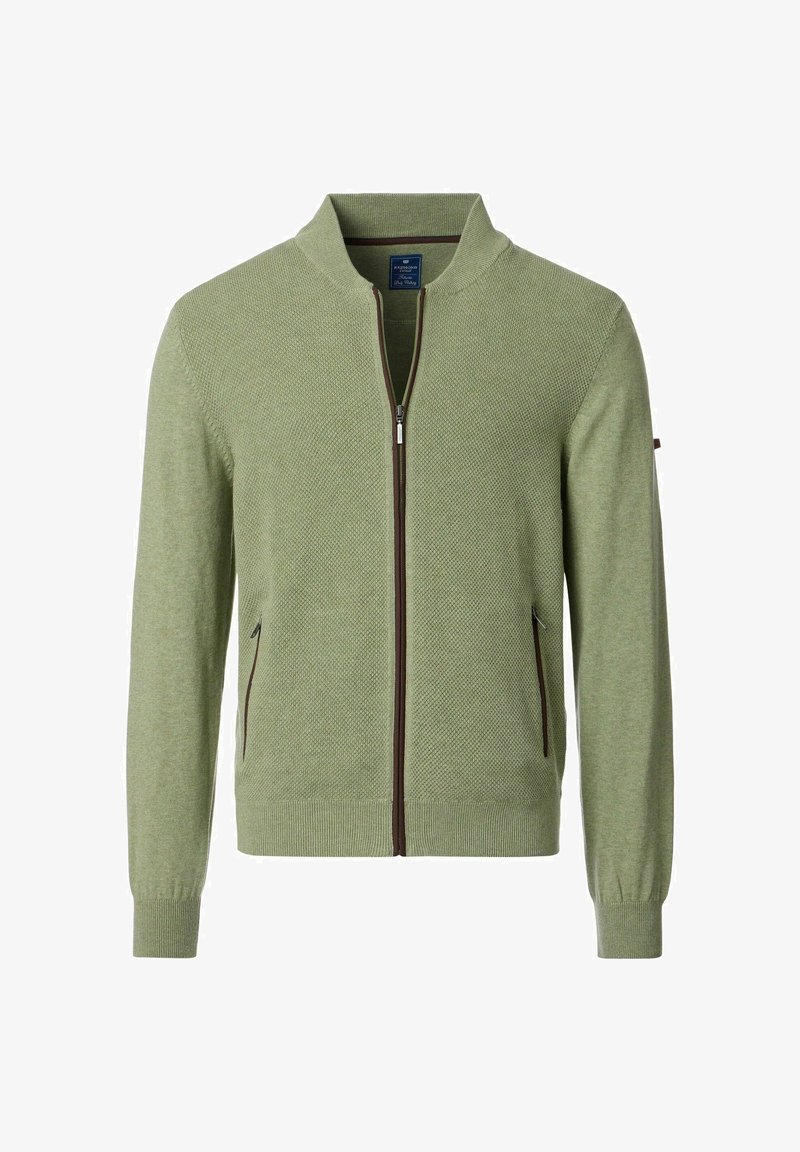 Jasnozielony sweter zapinany na zamek błyskawiczny z teksturowanym wzorem dzianiny, stójką i brązowymi akcentami zamka. Posiada boczne kieszenie.