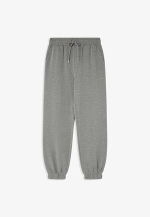 Szare dresy z tapered leg, elastyczną talią i sznurkiem, z bocznymi kieszeniami i elastycznymi mankietami przy kostkach.