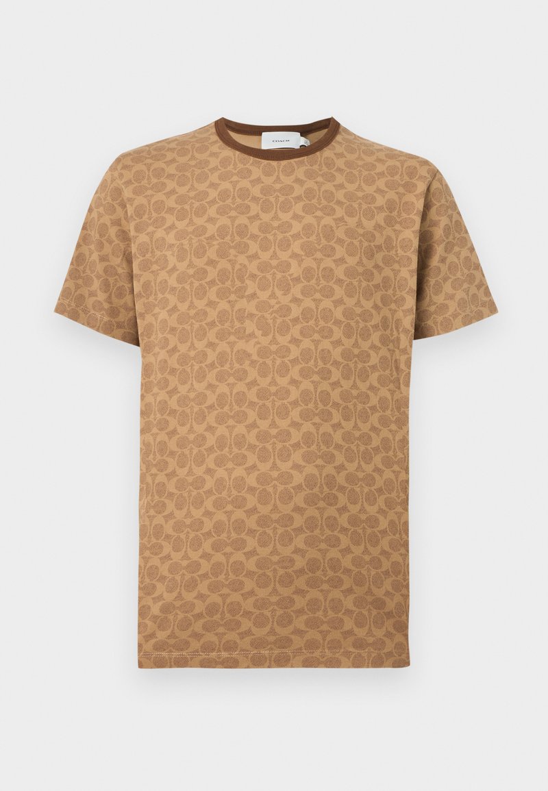 T-shirt marron à manches courtes avec un motif complet de logos "C" superposés de Coach et un col rond marron uni.