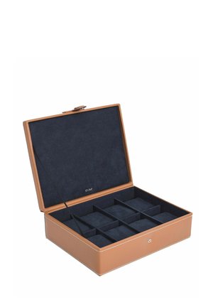 Leather jewelry box with a tan exterior and navy suede interior. Features nine compartments and a closure with a subtle metallic accent.