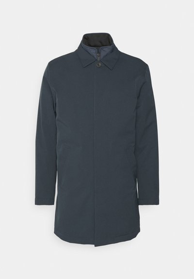 Navy blue coat with a collar, front button closure, and side pockets. Features a smooth, matte texture and a straight-cut design.