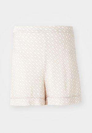 Beżowe szorty z geometrycznym białym wzorem, o miękkiej fakturze i prostym wykończeniu, zaprojektowane do noszenia na co dzień. Bez kieszeni ani ozdób.