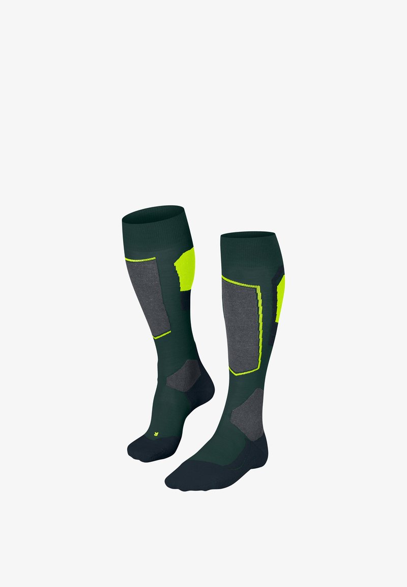 Chaussettes montantes vert foncé, agrémentées de sections grises et jaune vif ; design côtelé avec renforcement au niveau des orteils et du talon pour plus de durabilité.