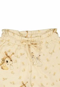 Beige puuvillapantsit, joissa on joustava vyötärö ja nyöri. Koristeltu pienillä eläinkuvilla ja kukkakuoseilla ympäri.