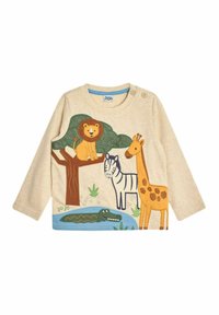 Maglietta a maniche lunghe color crema con applicazioni di animali colorati: leone su un albero, giraffa, zebra e coccodrillo, con un accento blu in fondo.
