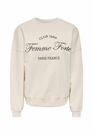 Beige sweatshirt med rund hals og lange ærmer, med sort tekst på fronten, der lyder "Club 1986 Femme Forte Paris France".