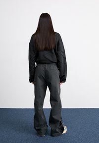 Nike Sportswear Treniņtērpa apakšdaļas - black