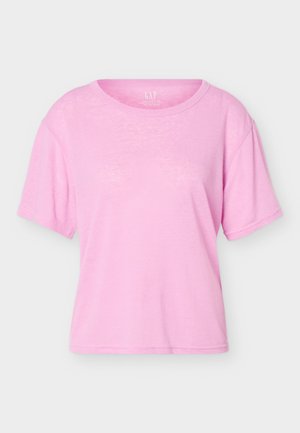 Tricou de bumbac roz deschis, cu mâneci scurte, guler rotund, croială largă și etichetă vizibilă GAP în interiorul gulerului.