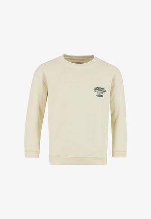 Jasnokremowa bluza z długimi rękawami, ściągaczami na mankietach i dole. Na przodzie znajduje się czarny napis z logo. Wykonana z miękkiej bawełny.