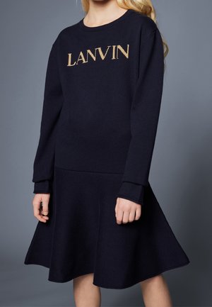 Navy sweater dress with 'LANVIN' logo in gold. Knit material, long sleeves, ribbed cuffs, and flared skirt with textured pattern at waist.