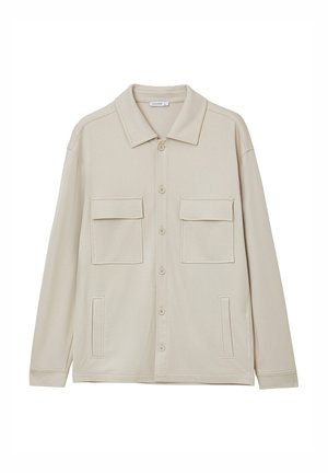 Veste beige à manches longues en tissu doux, dotée d'un col étalé, d'une fermeture à boutons, de deux poches poitrine et de détails sur les coutures latérales.
