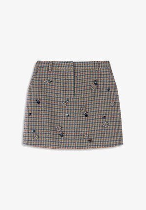 Geruit wollen minirok in bruin-, blauw- en groentinten, met decoratieve pailletten en een gestructureerd silhouet. Twee steekzakken aan de voorkant.