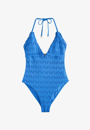 Yhden osan uimapuku kirkkaan sinisenä, jossa on teksturoitu aalto-kuvio, syvä V-pääntie, röyhelöolkaimet ja säädettävä solmukiinnitys.