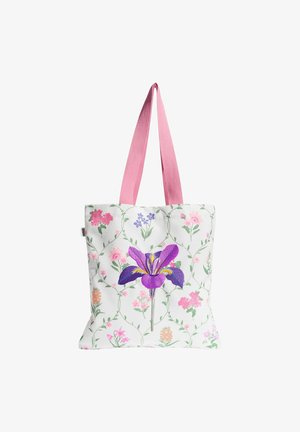 Hvid mulepose med pink håndtag, med et stort lilla iris og mindre pink, lilla og orange blomsterprint på stoffet.
