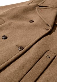 Brown wool coat featuring a double-breasted design, large brown buttons, and a small metal accent on the side pocket. Smooth texture.
