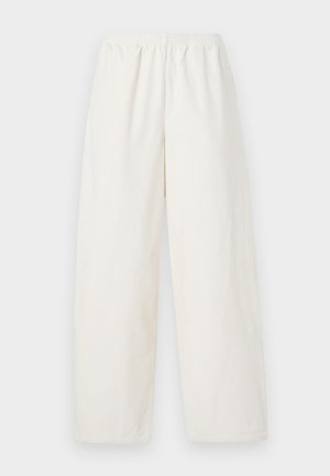 Balti, plačios kojos kelnės, pagamintos iš lengvos medžiagos. Elastinga juostos ir nepuoštas dizainas. Tiesus kirpimas iki kulkšnies ilgio.