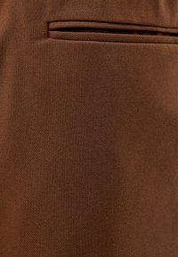 Bershka Teplákové kalhoty - brown