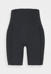 Hochgeschnittene schwarze Fahrradhosen aus Stretchmaterial mit strukturierten, gerippten Seiteneinsätzen und einem nahtlosen Vorderdesign.
