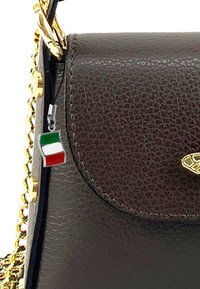 Brown textured leather handbag with a gold chain strap and a small silver charm featuring an Italian flag. Classic flap design.