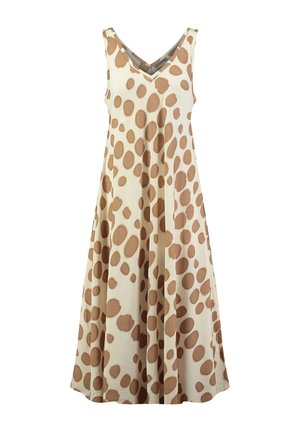 Mouwloze beige jurk met grote onregelmatige bruine polkadots en een V-hals, vloeiende A-lijn silhouet.