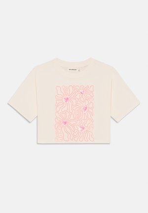 Cropped cream t-shirt with short sleeves featuring a pink abstract floral design and glitter accents. Made of soft cotton fabric.