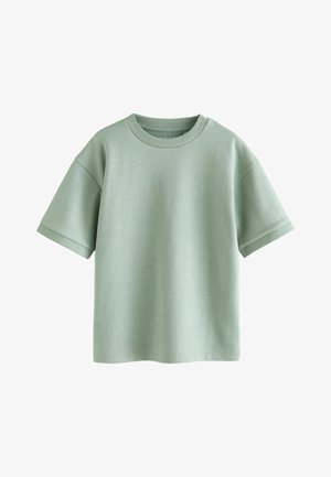 Heleroheline lühikeste varrukatega T-särk ümara kaelusega, valmistatud pehmest puuvillast kangast; omab lõdvestunud istuvust ja soonikkoes mansette.