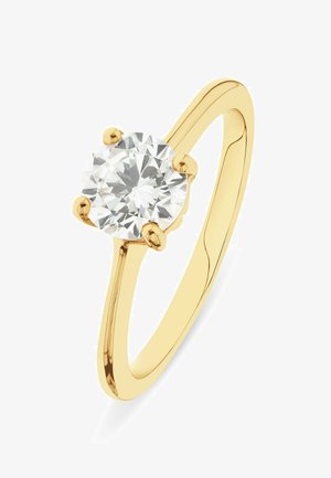 Yellow gold ring with a single round brilliant-cut diamond held by four prongs on a plain polished band.