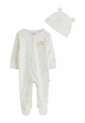 Fehér bordázott baba rugdalózó bézs csillagmintával és elöl cipzárral, hozzá illő sapkával, melyen macifülek és csillagminta található.