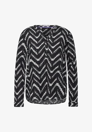 Langarm blouse in zwart en wit met een zigzagpatroon, voorzien van een V-hals en knopenlijst, van lichtgewicht stof en met een gebogen zoom.