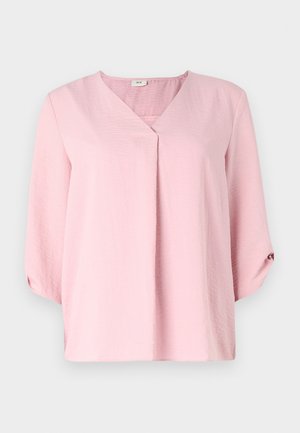 Pink blouse with a v-neckline, three-quarter sleeves, and a relaxed fit. Made from textured fabric with a slight sheen.