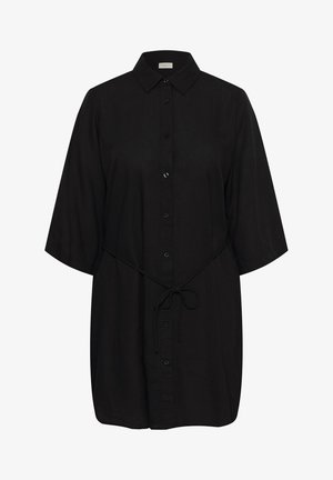 Mustast värvi põlveni ulatuv särk-kleit poolpikkade varrukatega, ees nööbitav, krae ja vööotsaga vöökohal.