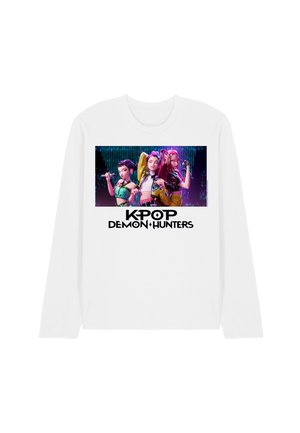White long-sleeve shirt featuring a colorful graphic of three characters and the text "KPOP DEMON HUNTERS" in bold black letters.
