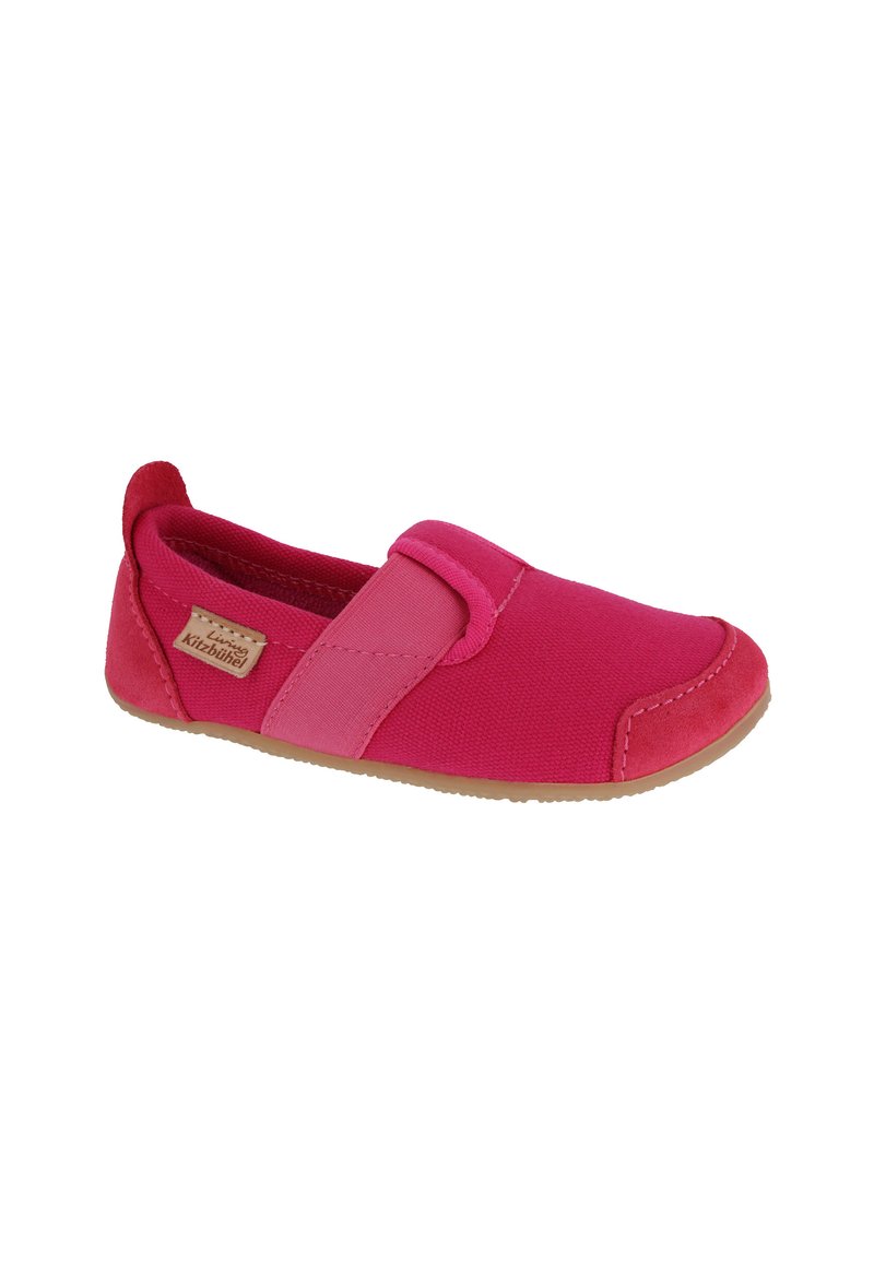 Pink slip-on shoe made of canvas with a smooth texture and suede accents. Features a rubber sole and overlapping color panels.