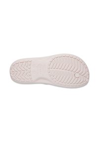 Semelle de chaussure en caoutchouc rose pâle avec un motif de semelle texturé, comprenant des rainures diagonales et des accents circulaires au centre.