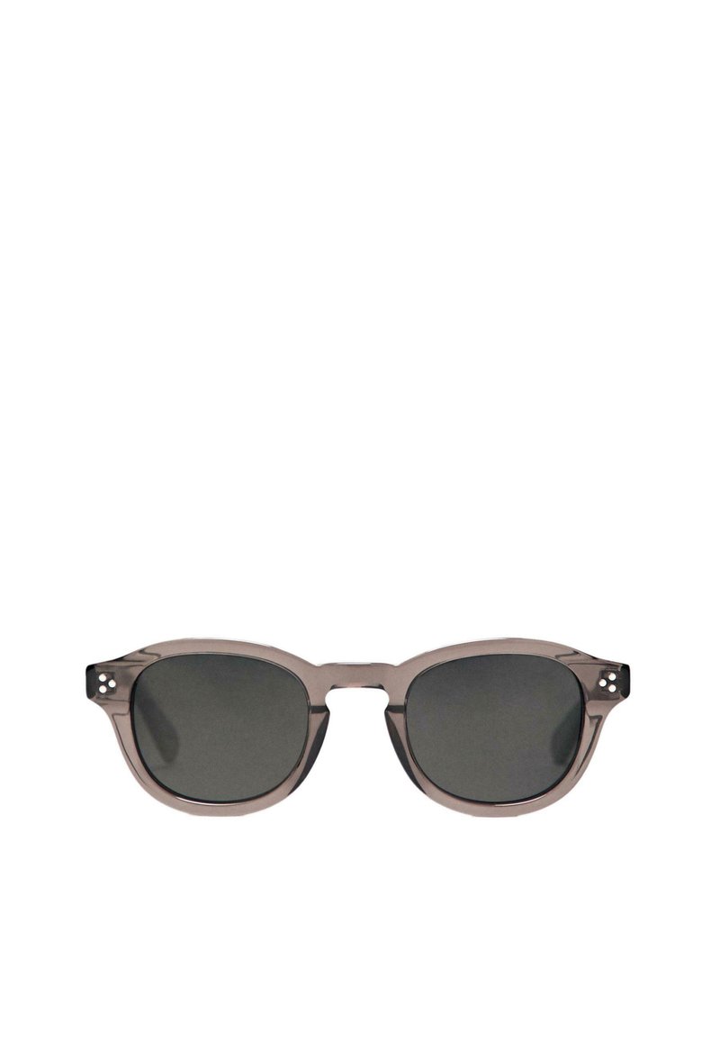 Gray plastic sunglasses with rounded edges, dark lenses, and small decorative rivets on the temple. Lightweight and modern silhouette.