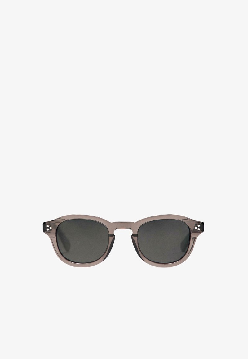 Gray plastic sunglasses with rounded edges, dark lenses, and small decorative rivets on the temple. Lightweight and modern silhouette.