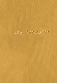 Yellow fabric with a textured appearance, featuring an embroidered logo "VAUDE" in a lighter shade, positioned on the lower left.