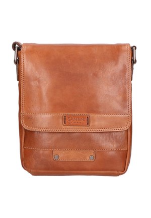 Tan leather crossbody bag with a flap closure. Features embossed logo, metal studs, and contrast stitching. Compact rectangular design.