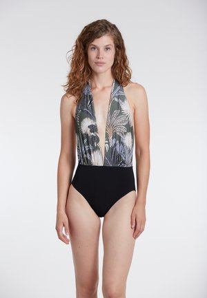 Eén stuk badpak met een diepe V-halslijn, een groene bloemenprint bovenstuk en een zwarte middensection; gladde, rekbare stof met hoge uitsnijdingen voor de benen.