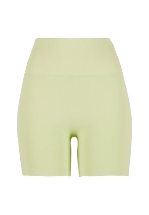 High-waisted, light green shorts made from stretchy fabric. Smooth texture; fitted design with a round cutout at the lower back.