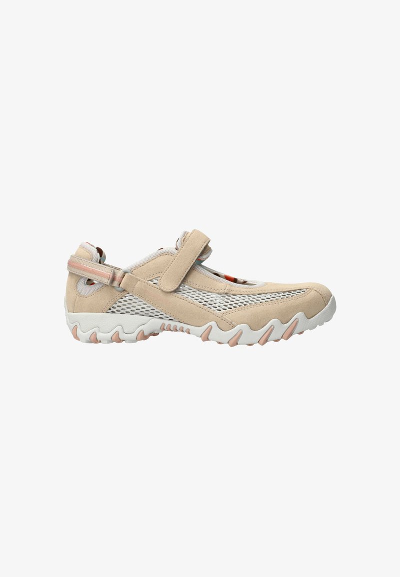 Beige Sport Schuh mit Mesh-Einsätzen, verstellbarem Klettverschluss, strukturiertem Gummisohle und gewellten weißen Akzenten auf der Außensohle.