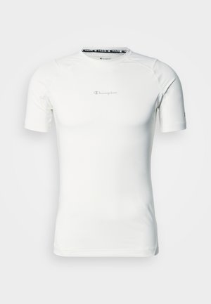 Tricou sport alb cu mâneci scurte și guler rotund, cu imprimeu logo. Realizat dintr-un material neted și elastic, cu un design potrivit pe corp.