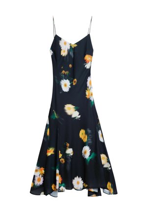 Robe florale avec un fond noir, ornée de grandes marguerites blanches et d'accents orange, fabriquée en tissu léger avec des bretelles spaghetti.