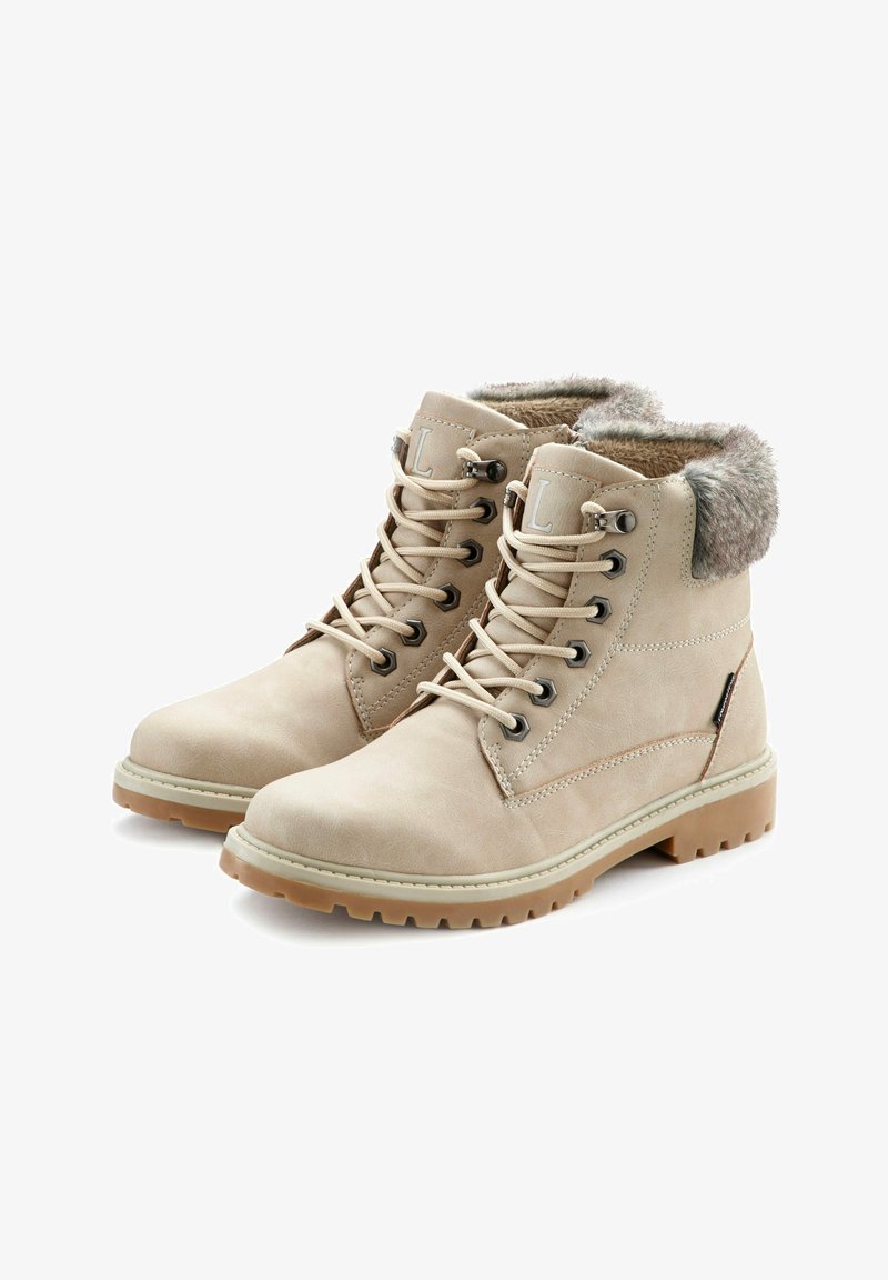 Beige enkellaarzen van fauxleer met een fauxbont kraag, ronde neus, vetersluiting aan de voorkant en een geribbelde rubberen zool.