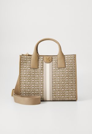 Tan tote bag with a patterned fabric featuring the letters 'DKNY'. It has a beige stripe and a gold logo accent. Includes a detachable strap.