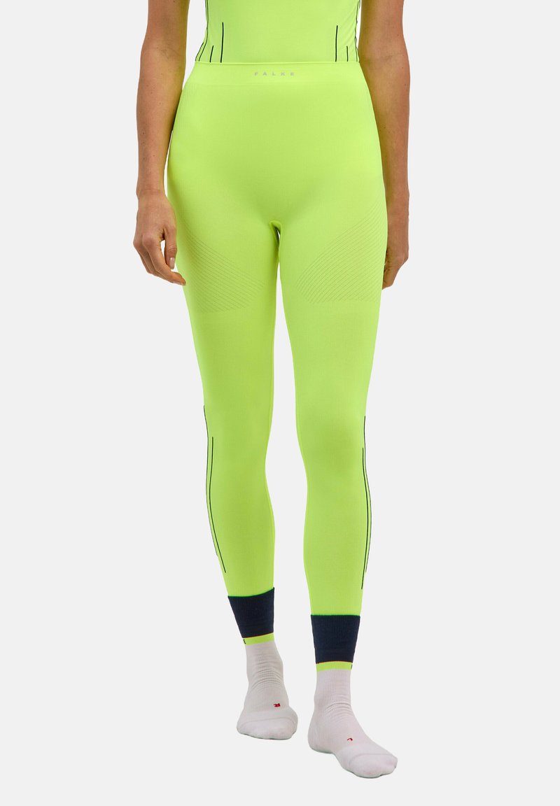 Neonowo zielone legginsy sportowe z teksturowanymi panelami i czarnym przeszyciem w akcentach; wysoki stan, dopasowany krój i tkanina odprowadzająca wilgoć.