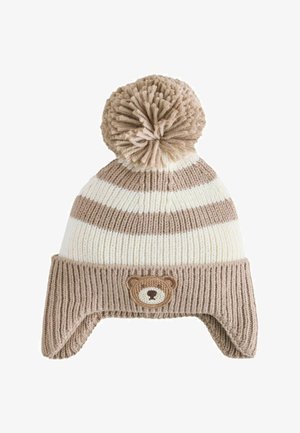 Knitted beige and white striped winter hat with ear flaps, pom-pom on top, and a small teddy bear face embroidered on the front.