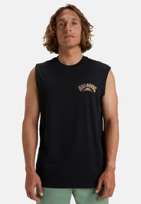 Black sleeveless t-shirt in cotton with a printed logo in red and yellow on the left chest; casual fit and crew neckline.